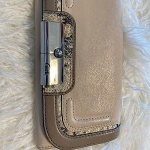 Coach Colette Beige and Python Snakeskin wallet. Measures 4”H x 8”L closed.